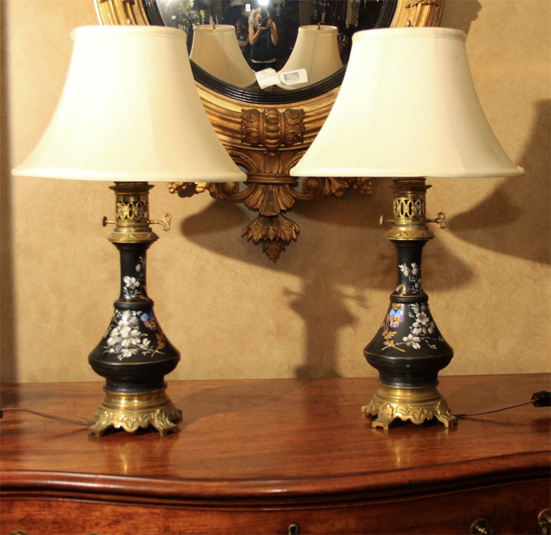 Pair is painted black, with floral decoration, highlighted with gilt and brass fittings. Shades shown for illustrative purpose only, to be sold without shades.

OFFERED AT THIS 50% OFF PRICE FOR 2015 ONLY!