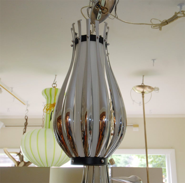 Mid-Century Modern Pendant Composed of Multiple Chrome Slats with Opaque Glass Cylinder For Sale