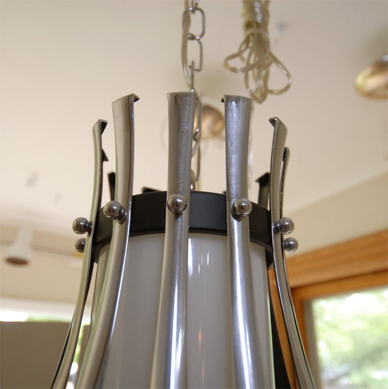 American Pendant Composed of Multiple Chrome Slats with Opaque Glass Cylinder For Sale