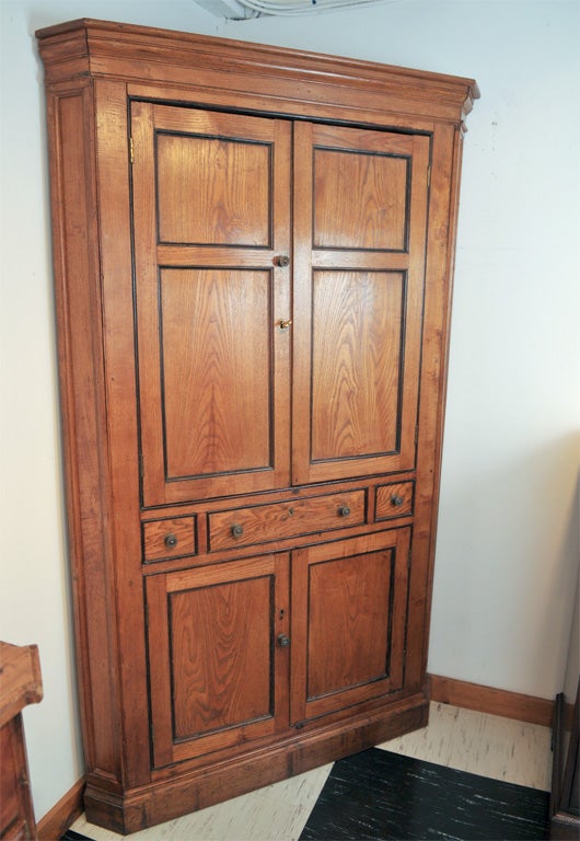 English elm corner cupboard with ebonized recessed panel frames, single drawer, plinth base. Overall, a nice, 