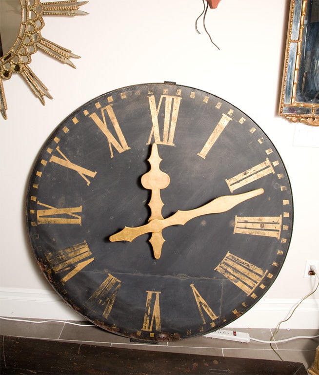 Early 19th C. French tower clock face.  Original black paint with gold gilt numerals and hands.  Cast iron, raised rim and zinc metal face.