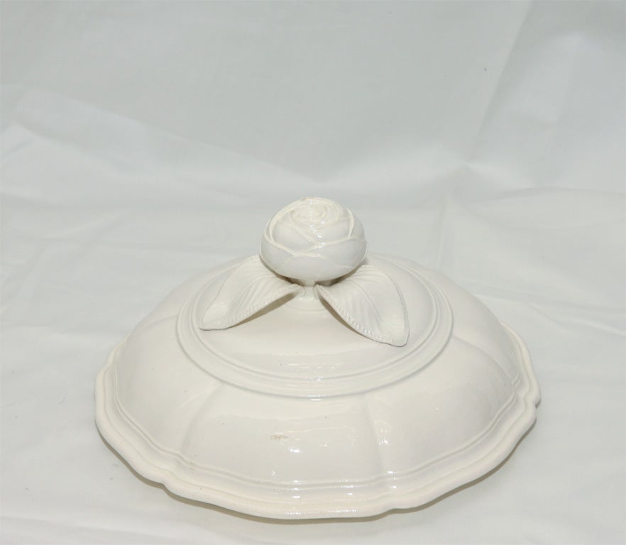 An outstanding 18th century French creamware round soup tureen with a rosebud finial and siver form border. See 