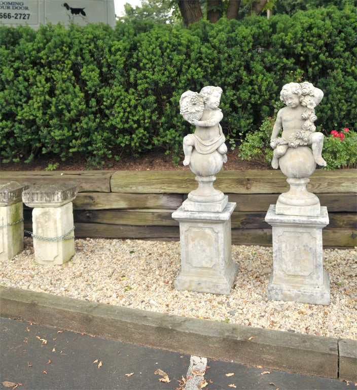 Pair of Stone Putti on Pedestals