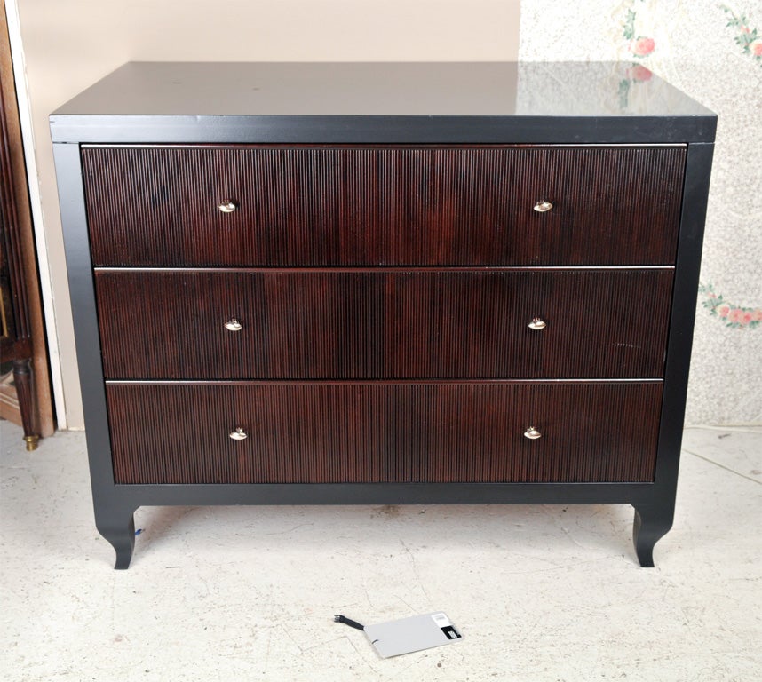 Pair of wonderful three drawer chest. Both designed by Barbara Barry for the Baker Furniture Company. Both bearing the Baker and Barbara Barry metal labels. Ebonized top and border surrounding a group of three mahogany drawers with chrome hardware.