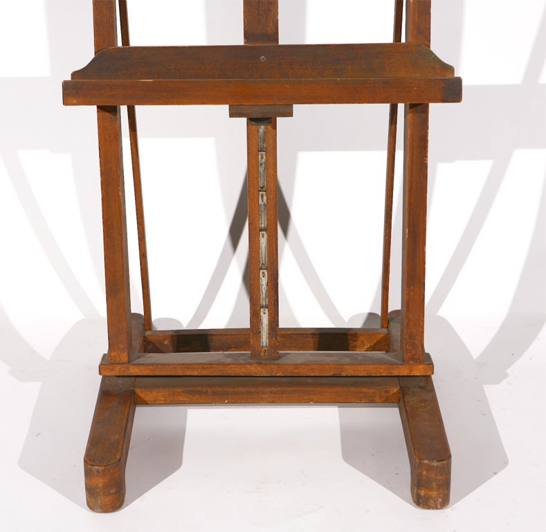 A vintage wood easel, great for holding a flat screen tv or a piece of art.