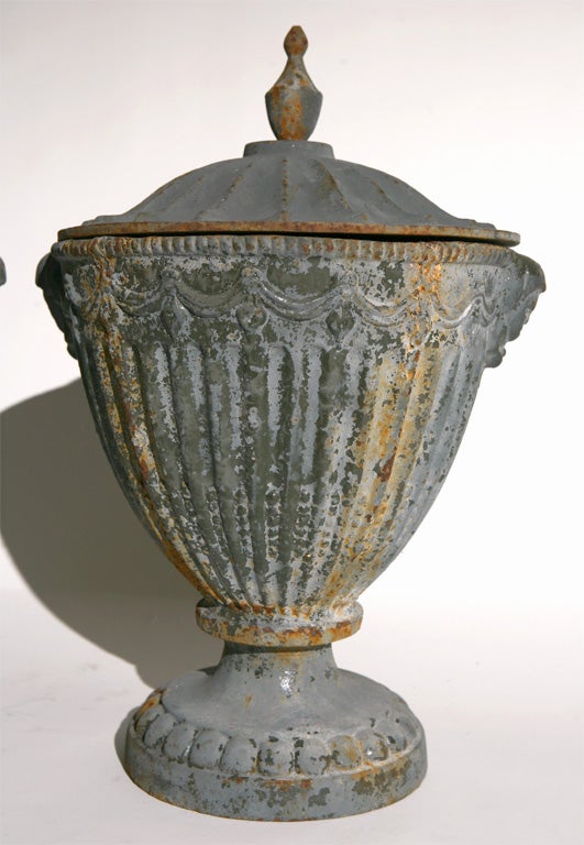 The classic elegance of these garden urns have been wonderfully aged by years spent in an English garden; the blend of the urns classic lines and the patina give them a special feeling that feels natural and timeless. They can continue to be used in