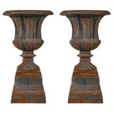 Pair of Cast Metal Urns and Stands