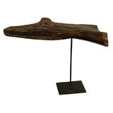 Vintage Papuan canoe prow with stand.