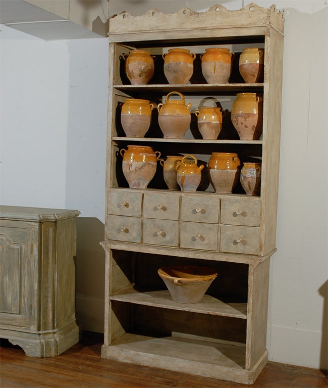 Two part shelf with apothecary style drawers.