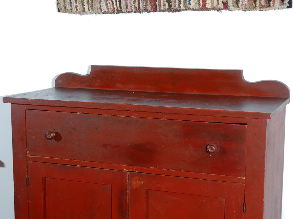 WONDERFUL EARLY 19THC JELLY CUPBOARD FROM NEW ENGLAND IN GREAT OLD SURFACE W/ALL ORIGINAL PAINT AND HARDWARE. THE CUPBOARD IS ALL SQUARE NAIL AND WOOD PEG CONSTRUCTION. THE PAINT IS FIRST COAT AND IN PRISTINE CONDITION. IT HAS WONDERFUL CUT OUT