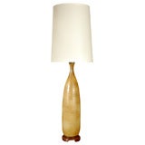 Tall green pottery lamp with wood base