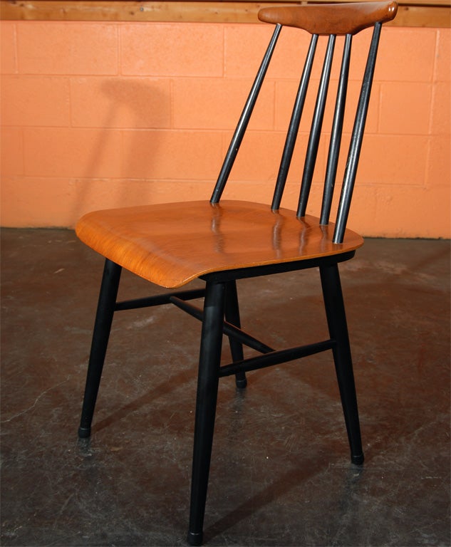A set of six mid century modern Fanett dining chairs.  They were originally designed in 1949 by Ilmari Tapiovaara and made in Finland by Asko.  The seat and back are natural.  The base and back spindles are ebonized.