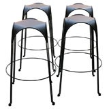 Set of four black steel and leather bar stools