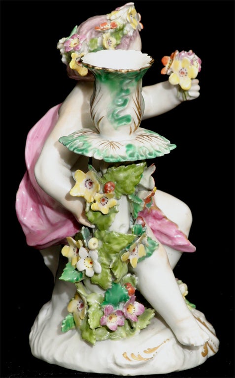 High rococo English art in the ceramic form of a cherub or

putto. Just what everyone needs to light their way in the dark.
