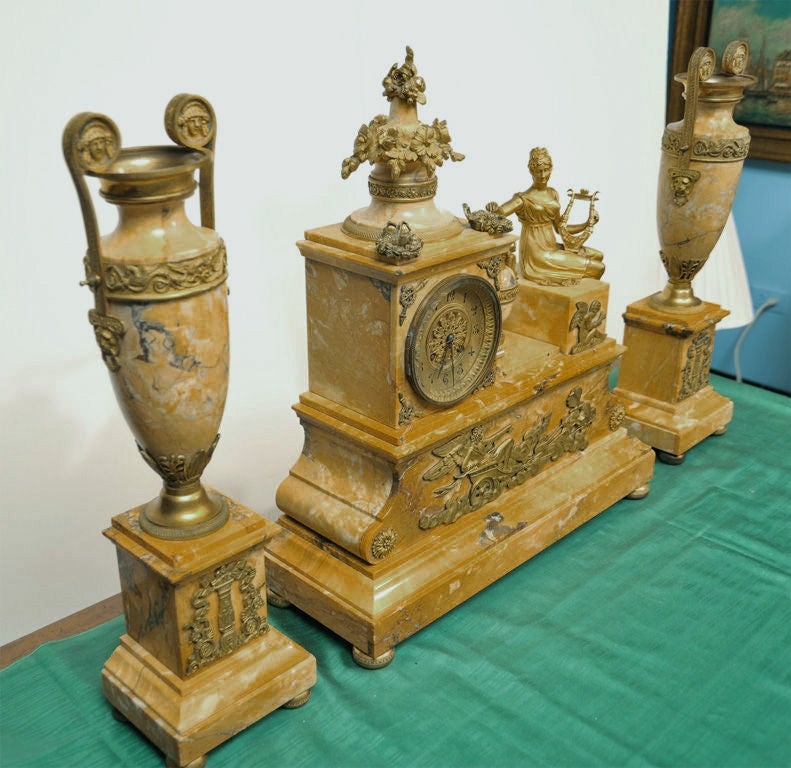 AN EMPIRE STYLE CLOCK GARNITURE. FRENCH, C. 1880