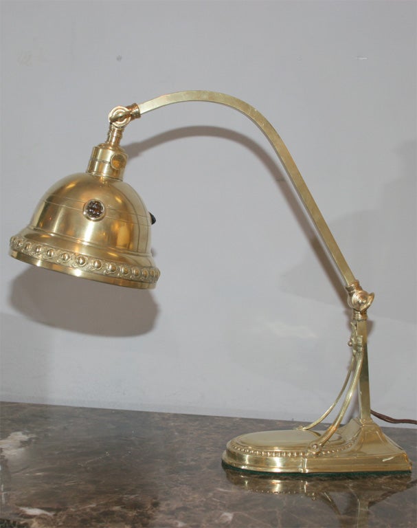 An articulated jugendstil brass and jewel table lamp.