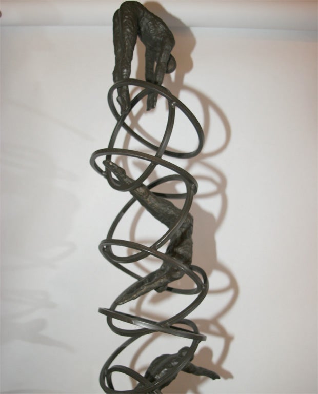 A Modernist Bronze Sculpture Man Diving thru Hoops 3