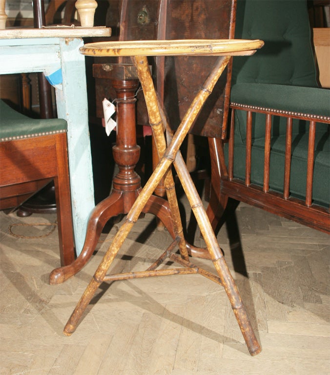 TRIPOD BASE WITH GRASS WOVEN TOP.