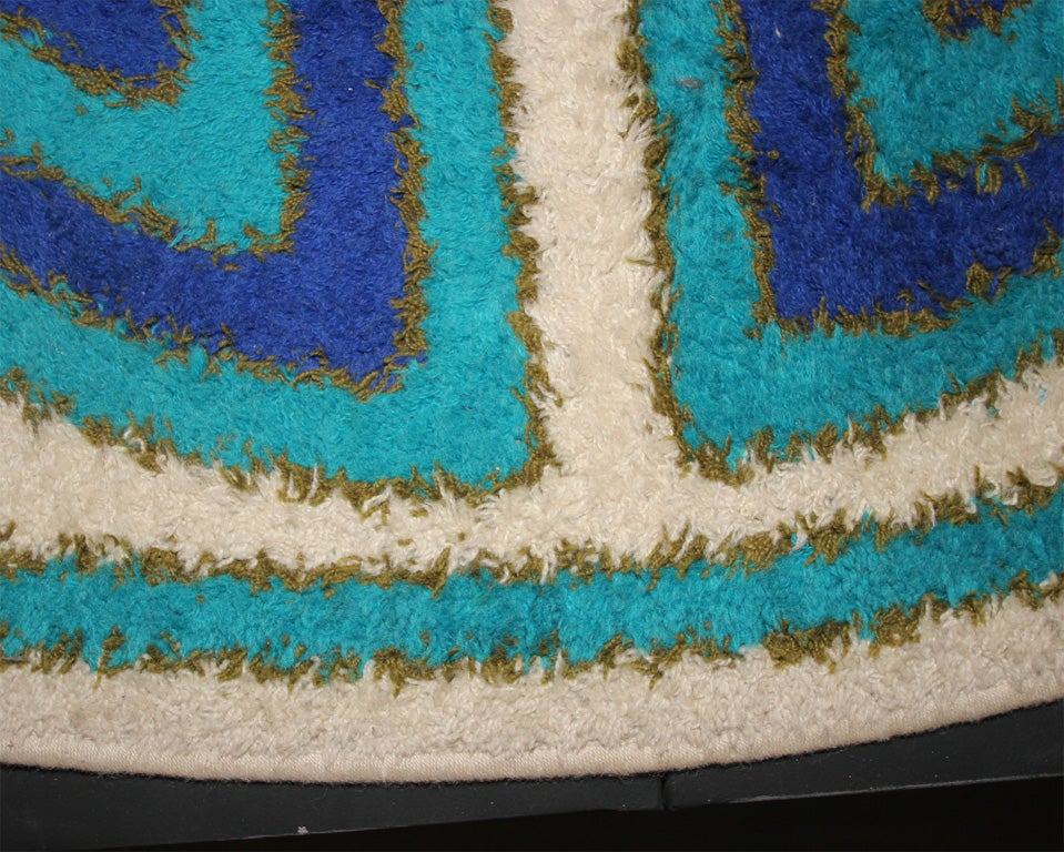 1970's Round Woven Wool Rug by Hojer.  Features Bulls Eye-like patterns with vivid complementary shades of Turquoise, Electric Blue, Royal Purple and Ivory.  Guaranteed to liven up any room!