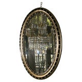 Fine Irish ebonized and gilt oval mirror, c.1820