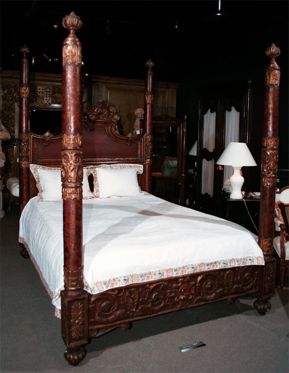 This piece probably dates from the early 1900’s and incorporates earlier elements.  The beautifully carved headboard pediment features scrolled elements surrounding a center crown.  The posts and front rail are beautifully carved and the bed is