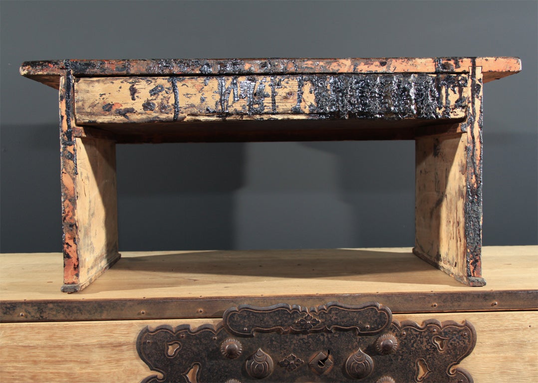 Japanese lacquer worker's desk constructed of Hinoki with Paulownia interior. The desk with a single drawer used to store tools of the lacquer workers trade the top used as a work station. The surface covered with multi-colored lacquered drippings