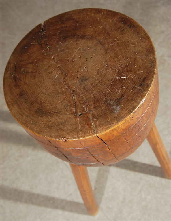 Unusual small round chopping block crafted from a single tree trunk, with spoke-shaved legs.  Mid to late 1800's.  Thought to be English.