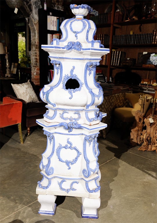 A beautifully designed French glazed terracotta stove with brass door. White with french-blue decorations. Functional with proper venting and disposal or can have heating element built into stove
