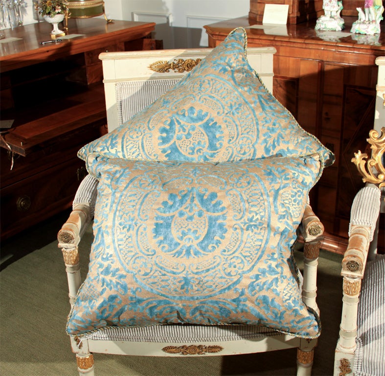 Two pillows in vintage Fortuny silk fabric. With a solid color silk fabric back and silk cording. Priced individually.