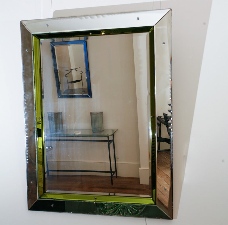 A Mid-Twentieth century coloured border glass mirror.