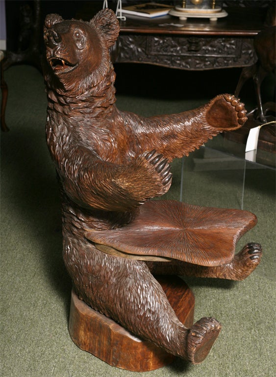 A very rare Black Forest bear chair, in the form of the playful bear.