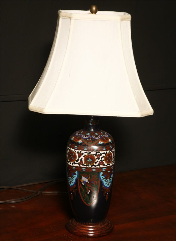 A cloisonne vase with lamp attached