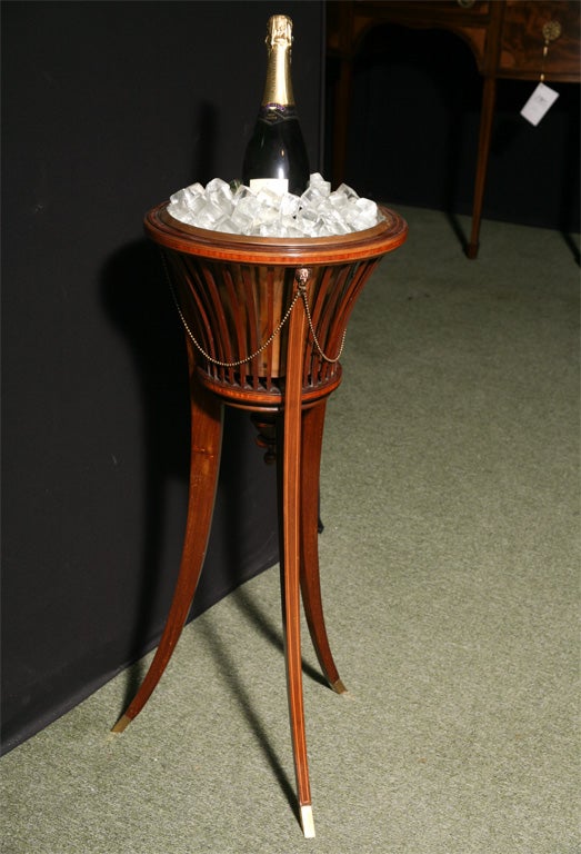 An English Edwardian wine bottle holder