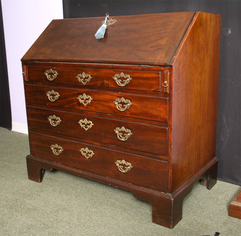 An English late 18th century mahogany slant top desk with secret drawers