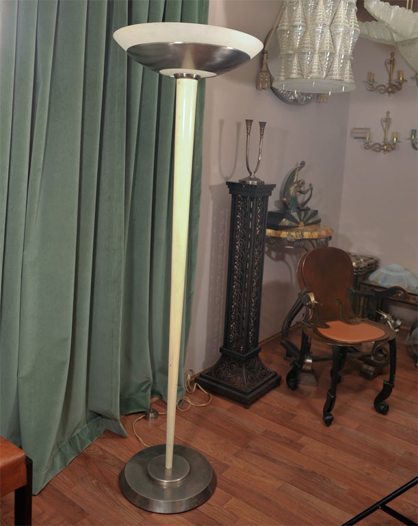 A French Art Deco floor lamp by Jean Perzel, circa 1930s. Frosted glass and chromed metal shade on a white lacquered conical base.