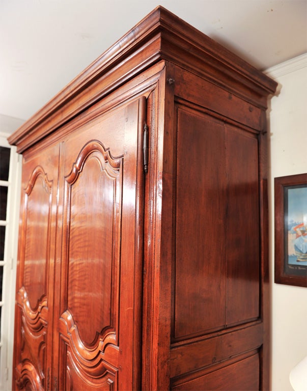 Distinctive Elegantly designed Armoire in rich, vibrant Cherry Wood, a rarity at the time where precious wood was reserved only for the front of the piece (the sides were mostly made of chestnut). This  Armoire all made of Cherry, front and sides is