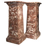Red marble pedestals in Louis Phillipe style.
