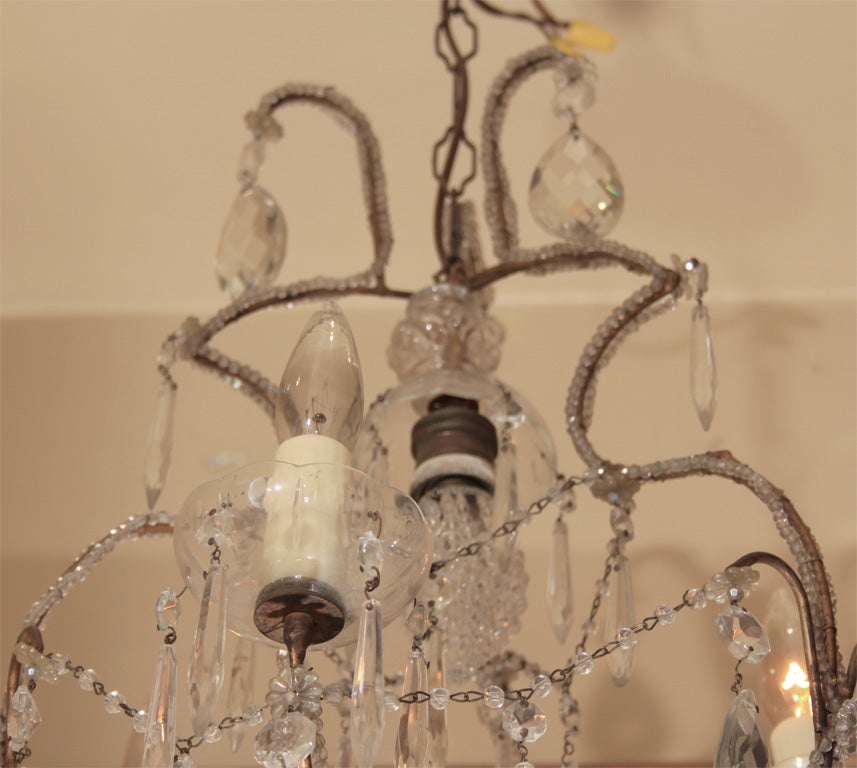 Chandelier with four lights.

OFFERED AT THIS 50% OFF PRICE FOR 2015 ONLY!