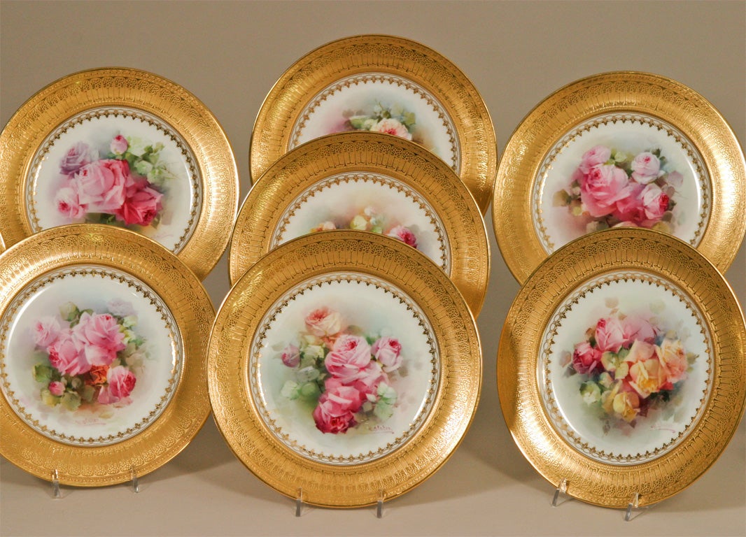 This complete set of uniquely hand painted cabinet plates depict different rose bouquets in varying shades of pinks, burgundy and pale yellow. The workmanship and talent is evidenced by one of the leading artists at Doulton, Walter Slater who worked