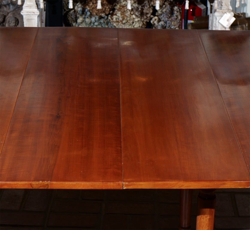 A FRENCH CHERRYWOOD DINING TABLE