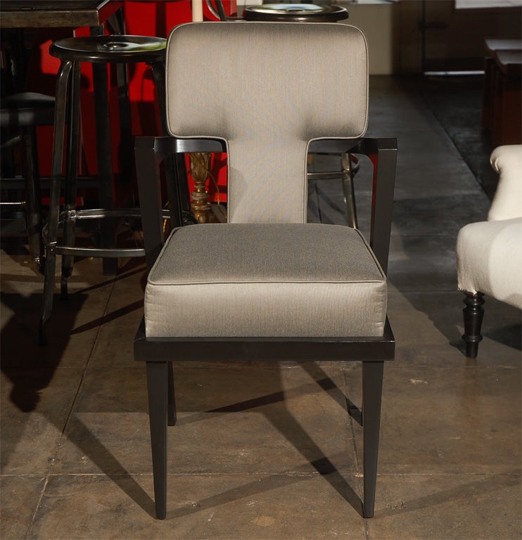 Wood Frame Arm Chair with wrap around upholstery.