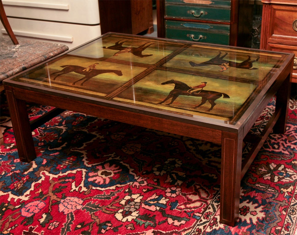 English coffee table. Mahogany frame with brass inlay and equestrian prints under glass.