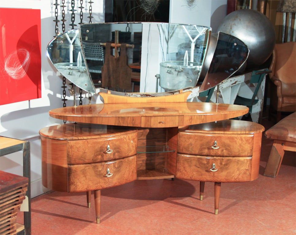 Ultra-chic, quintessential 1950's Storybook Vanity.  Three adjustable beveled mirrors floating above overlapping burl elliptical shapes make this a must-have for anyone seeking the ultimate stylish vanity or bar.
