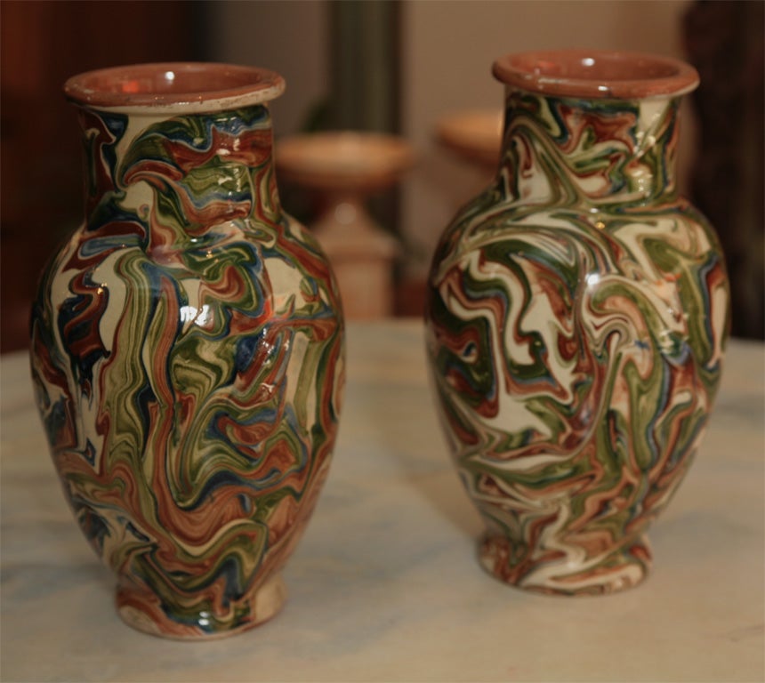 The wonderful swirl of pattern that coats these pieces are the natural clay. <br />
They are created, fired, and glazed by master artisans in France.