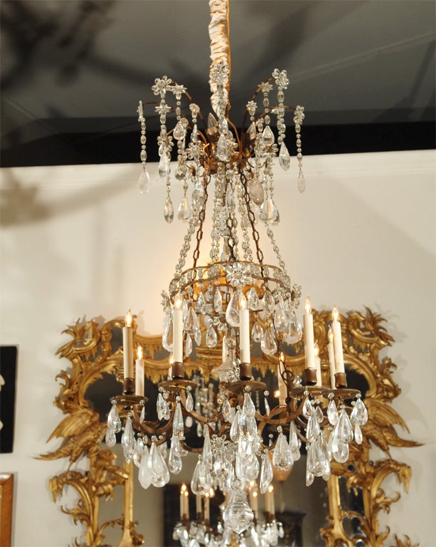 gilt bronze twelve light chandelier decorated with with large rock crystal drops, four up lights near the top of the fixture cast light on the ceiling<br />
<br />
(item comes with rendering of the same, tacked on cork board)