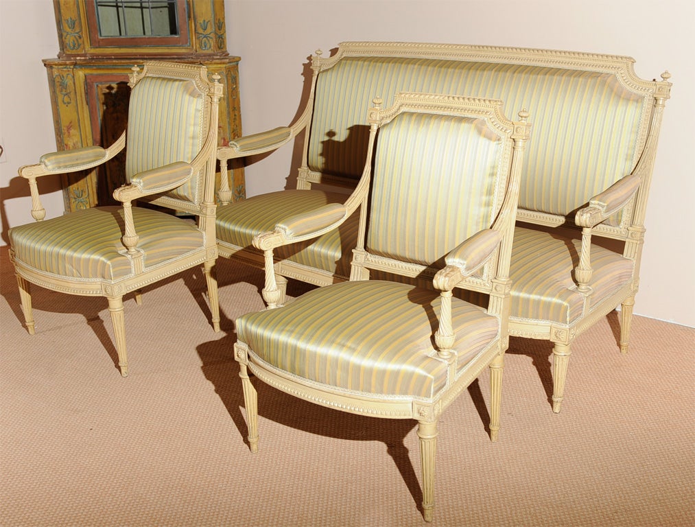 French Louis XVI style painted 6-leg sofa and pair of matching armchairs. Frames stamped 