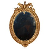 Antique French oval gold leaf mirror. Napoleon III.
