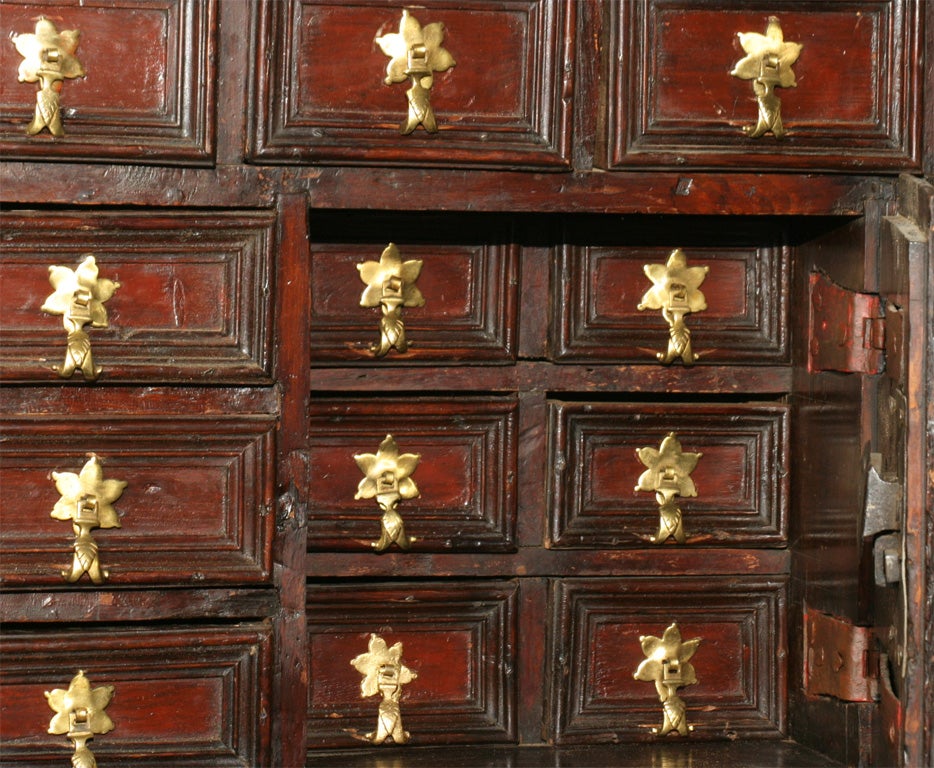 A WALNUT FLEMISH COLLECTOR  CABINET, WITH LOTS OF DRAWERS FOR COLLECTING AND DOORS TO CLOSE IT, BUT WHY WOULD YOU.