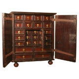 A Flemish Walnut Collector Cabinet With Doors