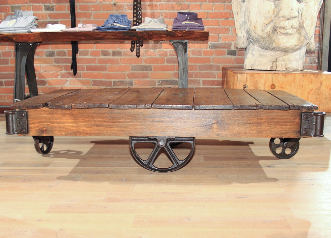Beautifully aged wood top with interesting wheel details.
